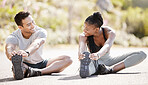 Sport, fitness and exercise with a sports man and woman training and stretching during an outdoor workout. Health, wellness and motivation with a male and female athlete ready to start a routine