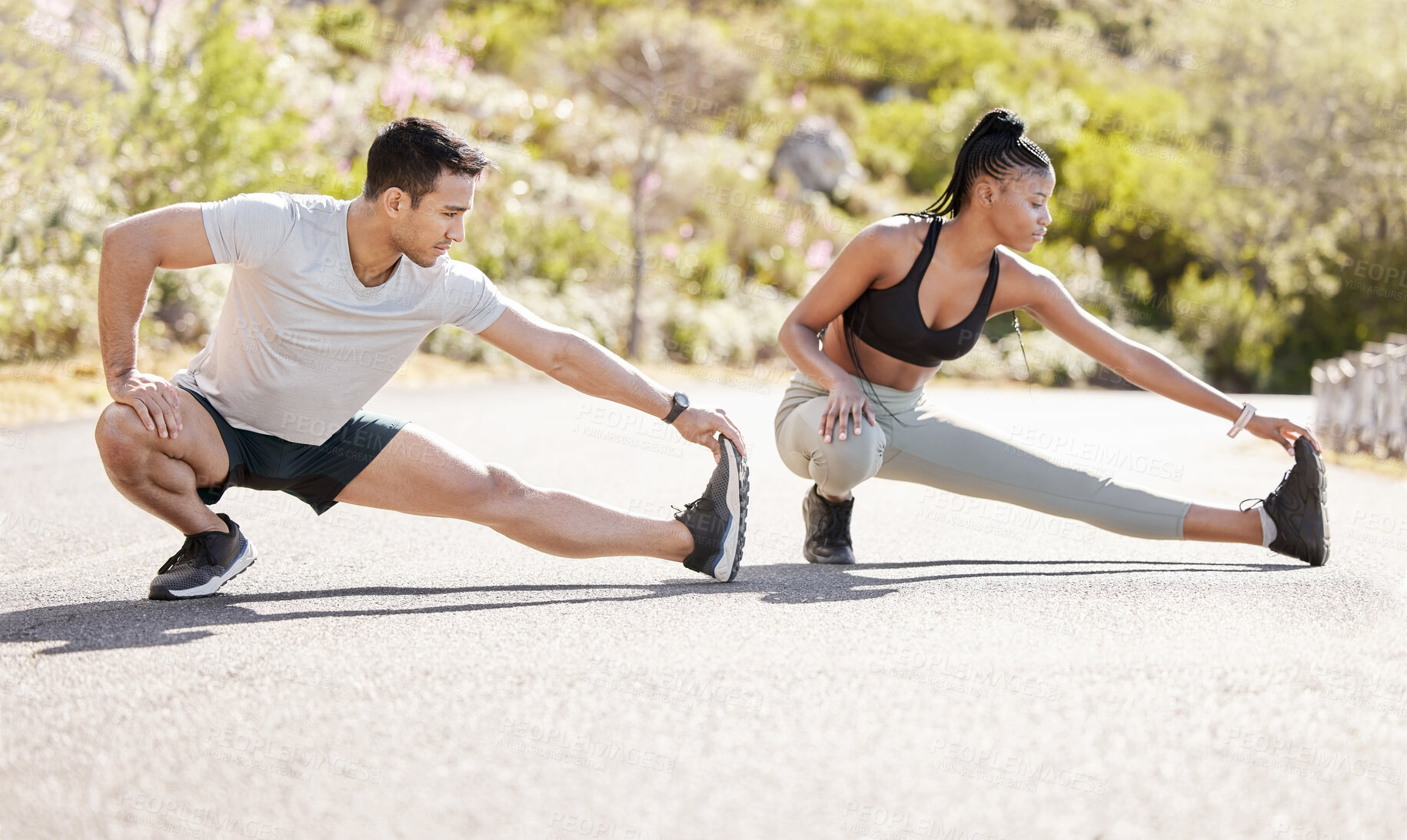 Buy stock photo Couple stretching, nature training and interracial team running for cardio exercise, motivation for run and start of workout journey together. Runner man and woman doing stretch for fitness in park