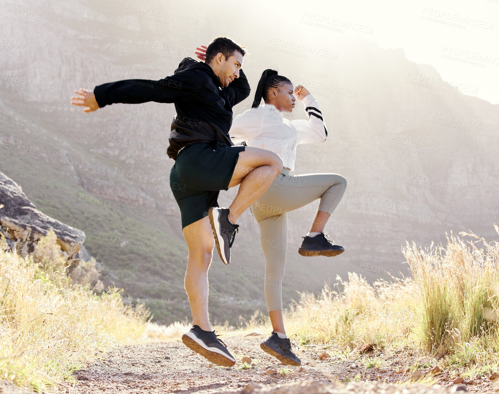 Buy stock photo Couple exercise fitness in Los Angeles park, jump stretching body and outdoor cardio workout on path. Black woman athlete in marathon training with man, runners on mountain range and action energy