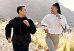 Couple, running and mountain on hiking, training or wellness trip in nature together with smile expression. Man, black woman and exercise on hill, workout outside for motivation and health of body