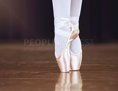 Buy stock photo Ballet, dance and shoes with the feet of a ballerina or dancer dancing on a theater stage for a performance or show. Creative, art and training with an artist or performer practicing for a rehearsal