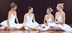 Ballet, art and women resting after training on a theater stage for a classical performance. Creative dance, elegant and dancers sitting on the floor and talking after practice to relax and rest.