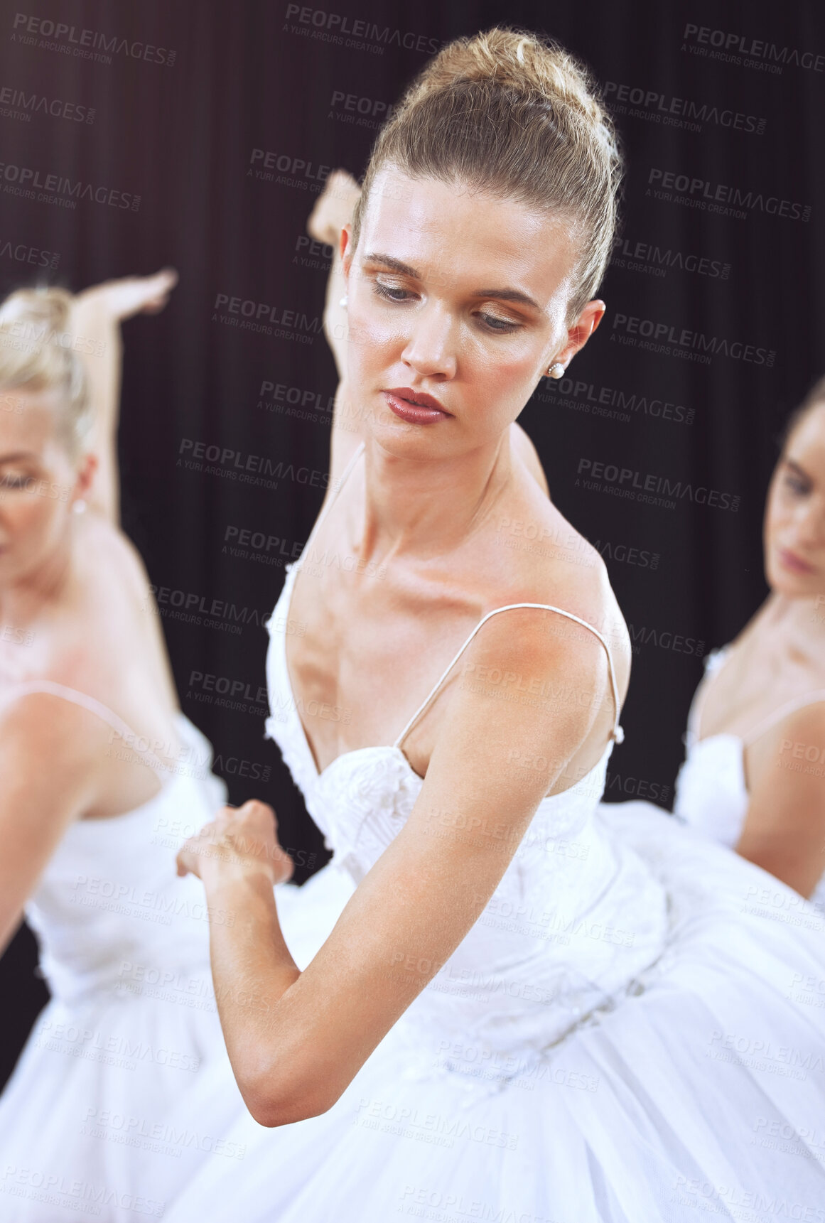 Buy stock photo Ballet, dance and art with a woman ballerina or dancer dancing on a theater stage during a performance. Creative, artistic and movement with a female artist or performer group training for a recital
