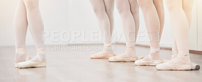 Buy stock photo Ballet, leader and dancer group feet in dance studio training in artist academy with white wall and floor. Women team, class or students dancing on pointe shoes for school performance with lens flare