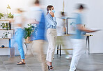 Covid, office and woman in phone call standing with face mask around work colleagues in motion blur. Female employee on mobile smartphone calling in a busy workplace of fast business people walking
