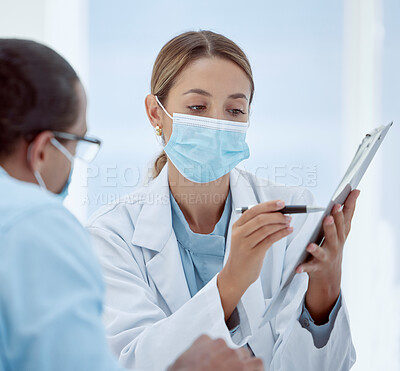 Buy stock photo Consulting, patient and doctor with mask and documents about health, chart and results. Health, covid and physician helps patient with vaccine forms, pandemic safety regulations or rules at hospital 