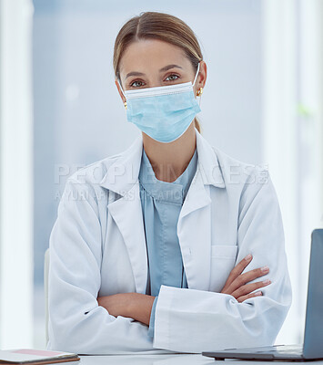 Buy stock photo Face mask, covid and portrait of medical doctor in her office at the hospital during pandemic. Coronavirus, woman and healthcare professional sitting at desk in consultation room at medicare clinic.