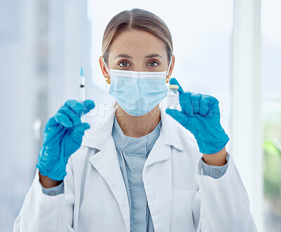 Buy stock photo Doctor, mask and needle with vaccine for covid in bottle at hospital, for health and community safety. Woman, medic and injection in lab to research for stop coronavirus, syringe, medicine or cure