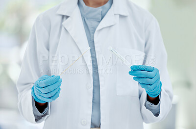 Buy stock photo Healthcare, hand and doctor with covid test in a hospital, hands holding pcr test and swab. Research, health and innovation closeup of nurse doing analysis of corona testing results medical sample