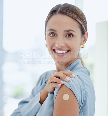 Buy stock photo Portrait of woman with a plaster on her arm from vaccine or an injection. Young, smiling woman with patch near her shoulder from getting vaccinated. Prevention, cure and immunity from covid or virus