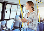 Woman, bus travel and phone on public transportation while thinking and using social media or internet app for information about city traveling. Female passenger with 5g network cellphone in town