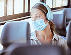 Covid face mask, headphones and woman on bus sad or worried while listening to podcast or music. Person travel in city train transportation with 5g and audio live streaming corona virus news update 