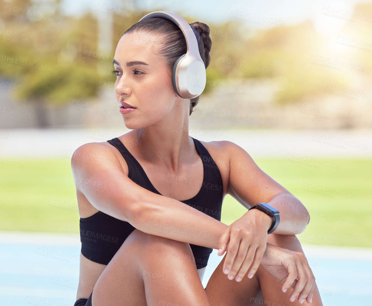 Buy stock photo Music, fitness and relax with a sports woman taking a break from her workout, exercise and training for health and cardio. Health and wellness with a female athlete listening to audio on headphones