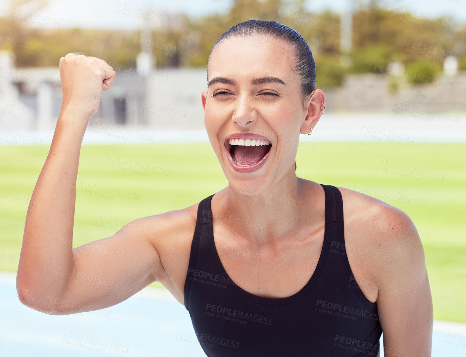 Buy stock photo Celebration, winner and runner at a sports stadium cheering after winning a marathon race. Success, celebrate and young woman athlete happy about a victory an a track competition on a field.