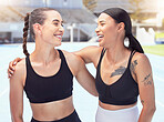 Fitness, sports women friends or personal trainer people hug and smile for support, motivation and workout goal at outdoor stadium with lens flare. Athlete couple at arena happy with training results