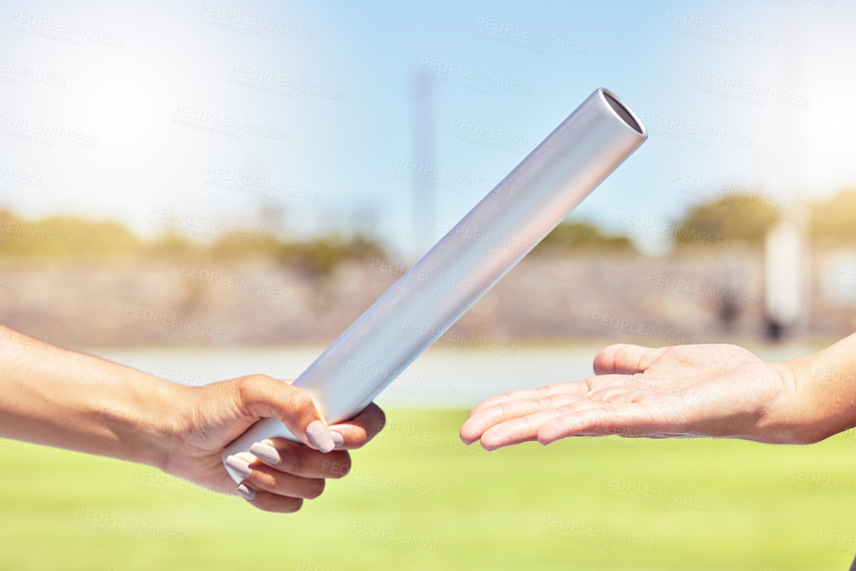 Buy stock photo Teamwork, sports and hands of runner with relay race with baton in field stadium event for health, training or fitness. Partnership, goal and support with athlete running in exercise or competition