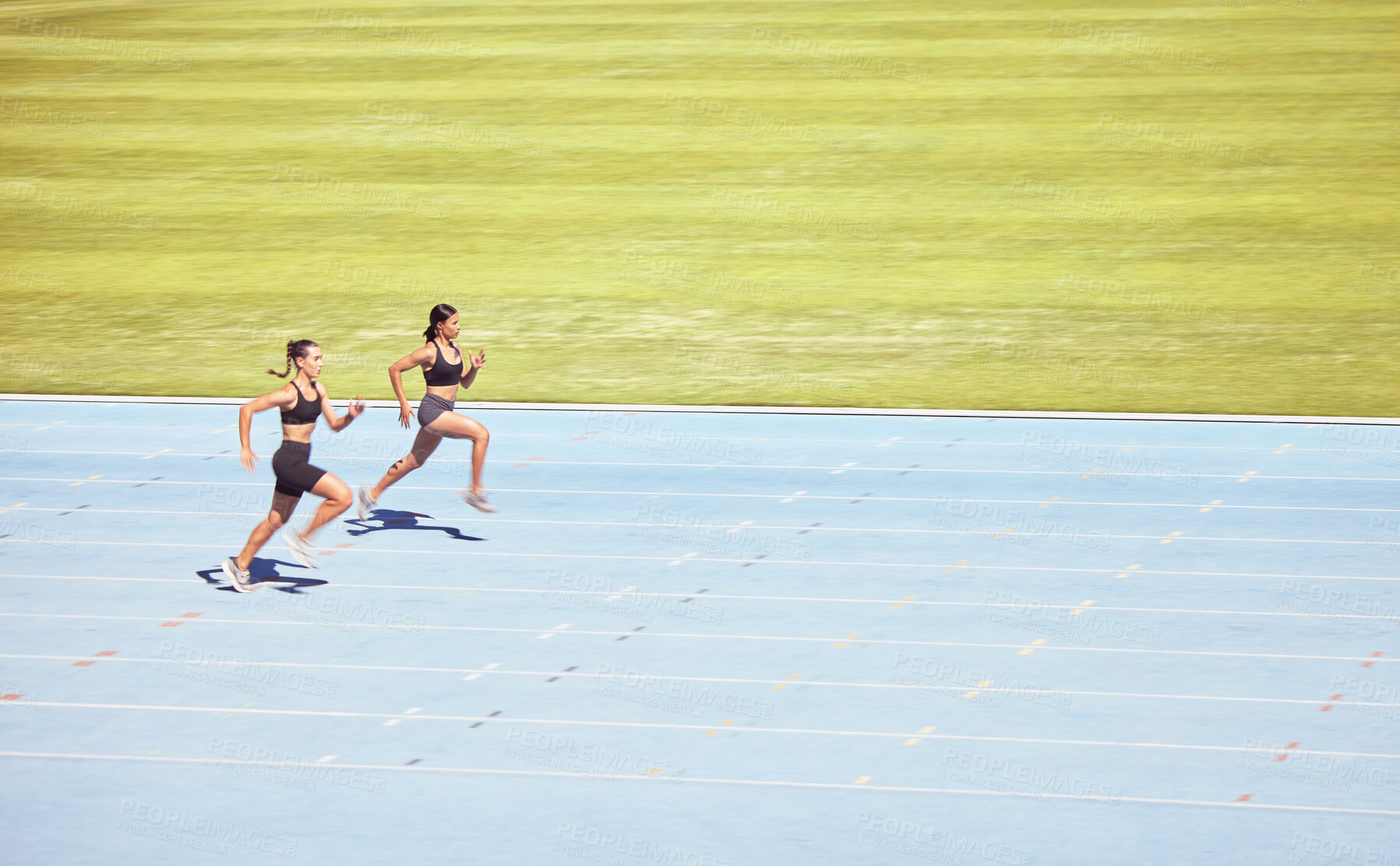 Buy stock photo Mockup space, runner and woman exercise, training and running on track for race. Health, female athletes and runners workout, sprinting and competing on race course, field and arena in sportswear. 