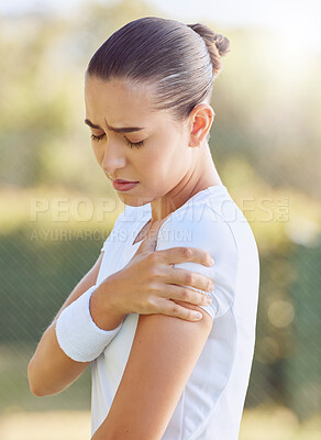 Buy stock photo Sport, exercise and pain with an arm injury on a sports woman standing on a court outdoor. Fitness, workout and training with a female athlete suffering with an accident or medical emergency
