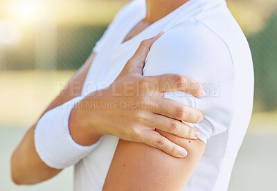 Buy stock photo Sports, muscle pain or injury of tennis player woman during fitness, outdoor training or exercise with sunlight bokeh. Athlete person with hand on arm for medical insurance or healthcare emergency