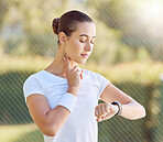 Fitness, time and workout with a sports woman looking at her watch while checking her heart rate or pulse. Training, exercise and health with a female athlete tracking her progress during a routine