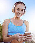 Phone, music and fitness with a sports woman training outdoor during an exercise or workout routine. Health, app and motivation with a female athlete tracking her progress, goal and target outside