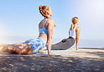Fitness women, yoga stretching and cobra workout in outdoor sunshine for wellness, balance training and strong body. Calm, healthy lifestyle and flexible friends pilates exercise performance together