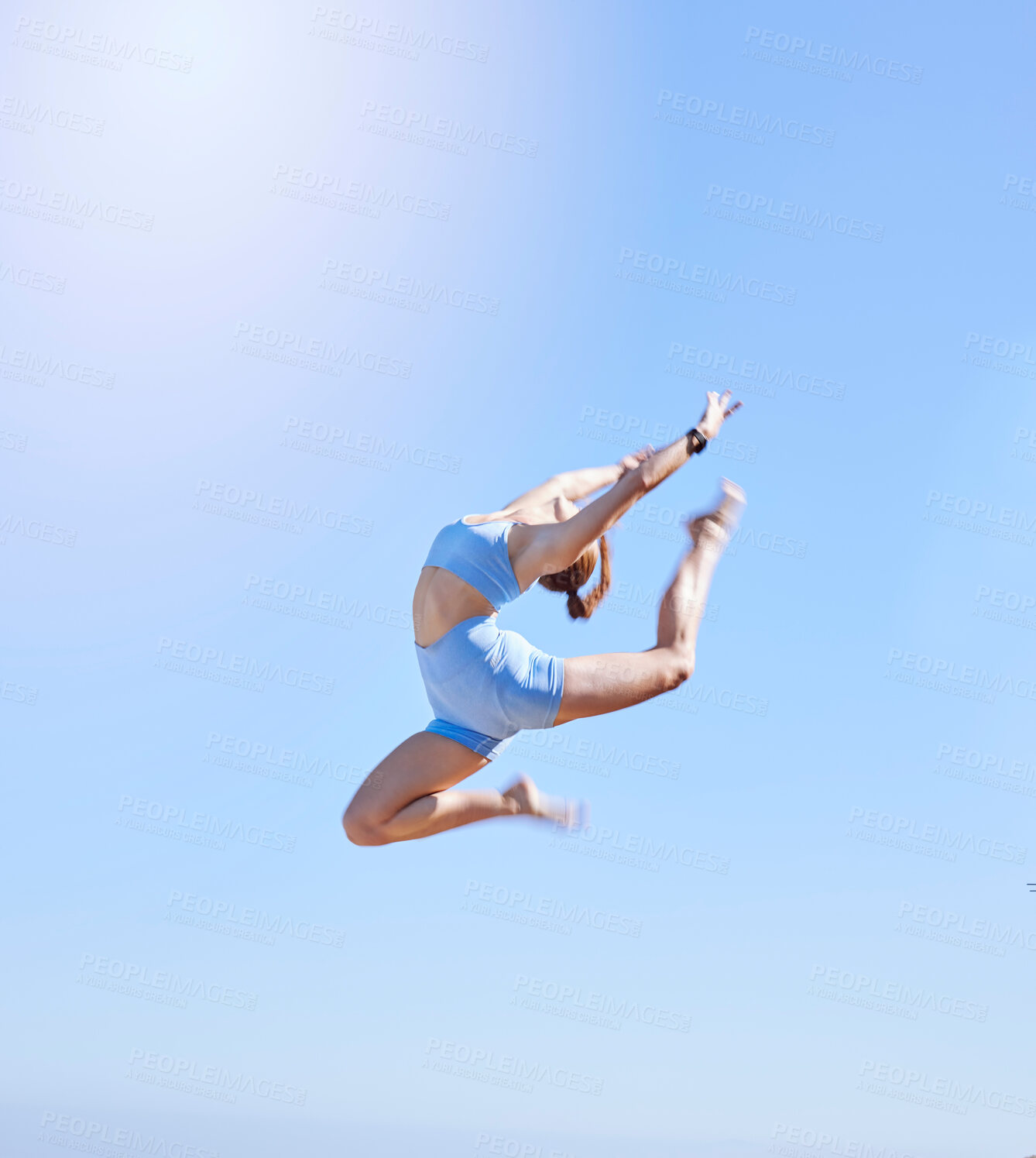 Buy stock photo Fitness, jumping and sky with a sports woman mid air outdoor against a clear blue background during summer. Workout, exercise and training with a female athlete leaping for health and wellness