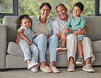 Grandparents, children and sofa happy in home living room on vacation or holiday together. Kids, grandma and grandpa in retirement smile on couch in lounge with love for family portrait in house