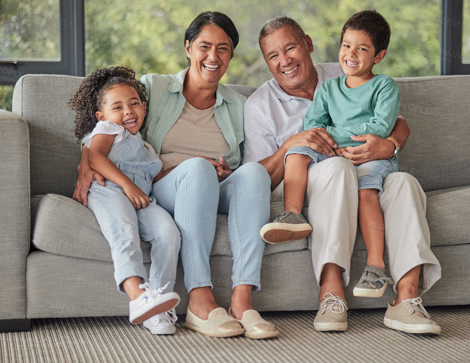 Buy stock photo Grandparents, children and sofa happy in home living room on vacation or holiday together. Kids, grandma and grandpa in retirement smile on couch in lounge with love for family portrait in house