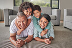 Grandparents, children or bonding in fun play game on house or family home living room floor. Portrait, smile or happy senior man and mature woman babysitting grandchildren or kids together in lounge