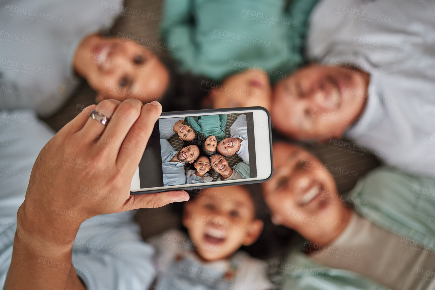 Buy stock photo Family selfie, phone face and hand of man with technology with grandparents and children, smile while relax and happy on living room floor. Parents, kids and elderly people taking photo on tech