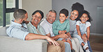 Funny family, sofa love and grandparents in comic conversation with children, happy on couch together and smile in living room. Children and parents in communication with elderly people in home