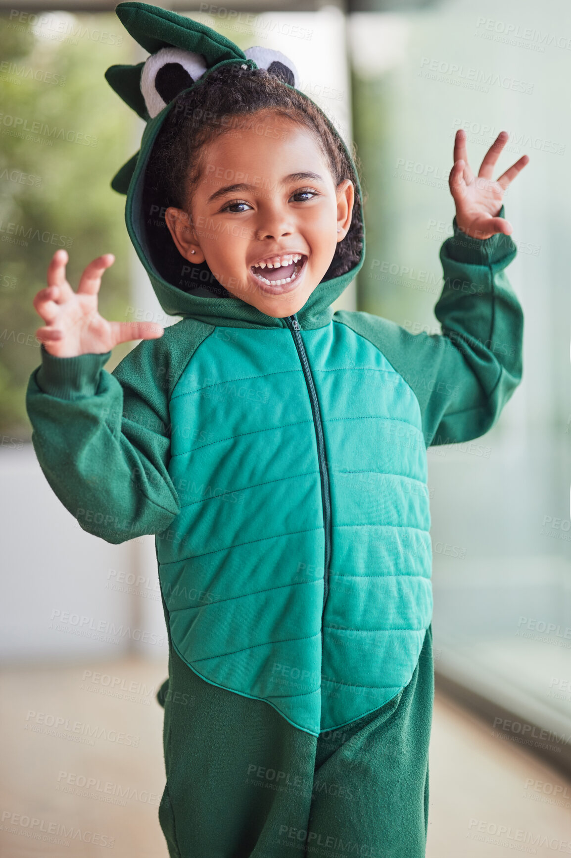 Buy stock photo Child, halloween and playing role in costume in a living room at home and having fun being creative. Happy girl kid as fantasy dinosaur in character, smiling and excited to roar and play game 