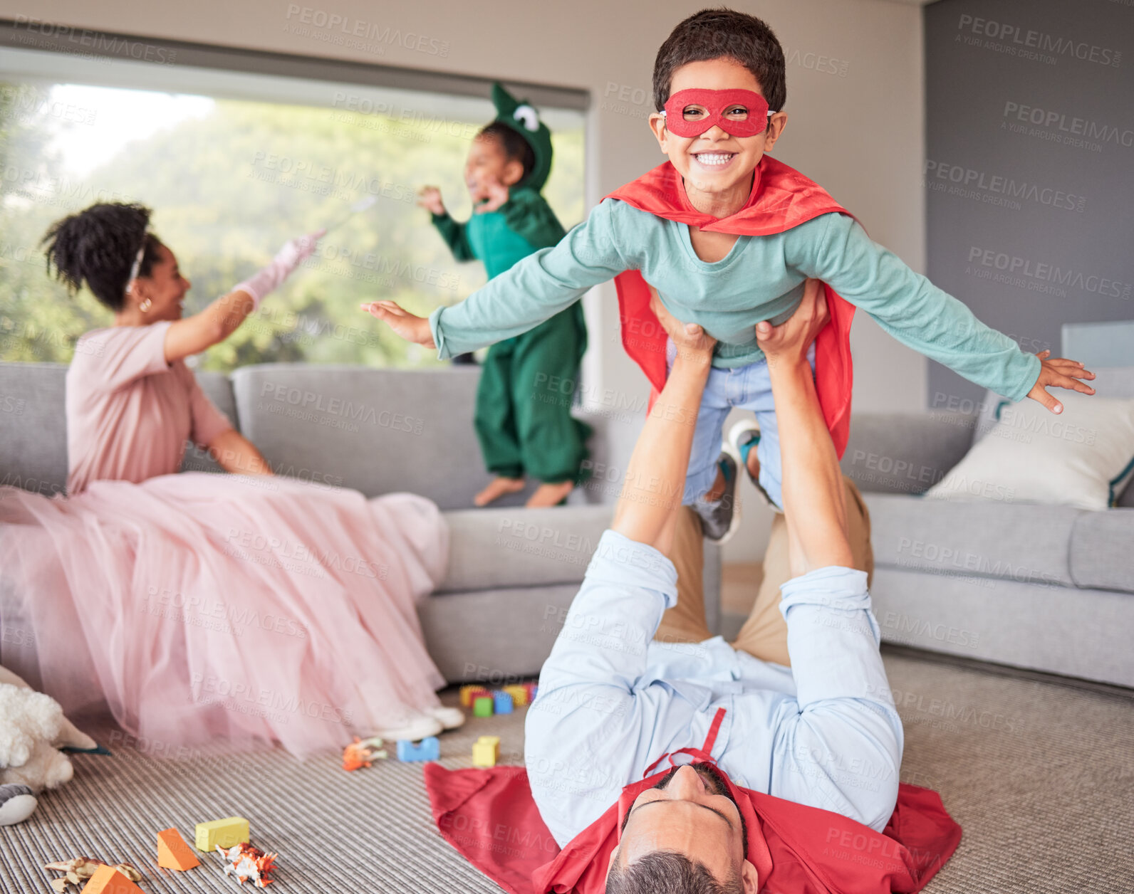 Buy stock photo Happy parents and children in costume playing, bonding and having fun together in living room. Happiness, excited and family enjoying fantasy dress up for halloween entertainment with kids at home.
