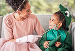 Fantasy, mother and child in halloween costume at home with girl in a dinosaur outfit and mom as a fairy princess. Smile, happy and young kid excited for a holiday celebration with a single parent
