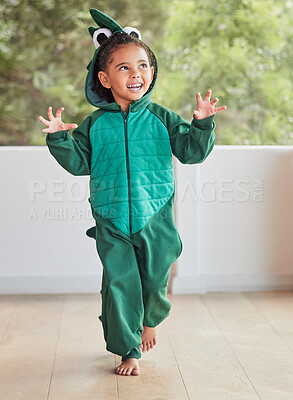 Buy stock photo Child, smile and excited in halloween dinosaur costume at home playing role and having fun at party. Happy kid being playful with fantasy character in living room mimic animal actions ready to roar. 