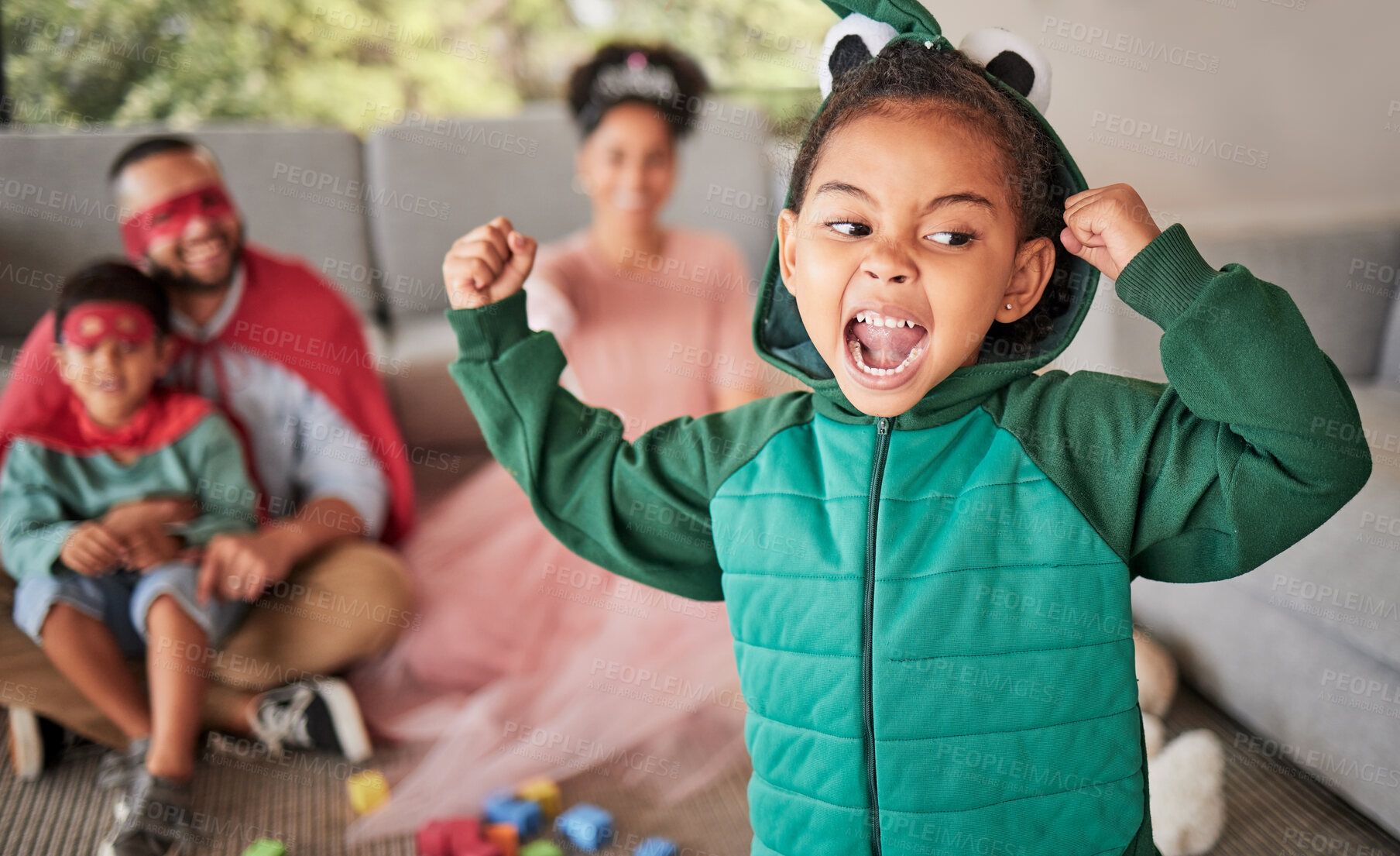 Buy stock photo Child, fun and dress up for Halloween with energetic, brave and strong girl playing dress up wearing costume with family at home. Energetic, playful and imagination of kid during pretend game