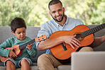 Father teaching child guitar, learning music skill in brazil home and happy singing together. Acoustic musical instrument, young guitarist plays ukulele and training with musician dad in fun family