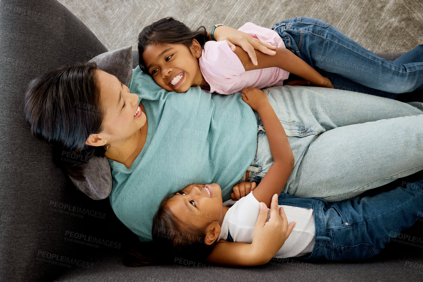 Buy stock photo Happy family, children and mother bonding on a sofa with her daughter, relax and happy in a living room from above. Love, kids and mom laughing and loving, enjoying time together and being a parent