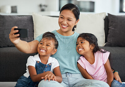 Buy stock photo Selfie, family and children with a girl, daughter and foster mother taking a photograph in a living room of the home. Kids, love and affection with a woman, sister and sibling together in a house