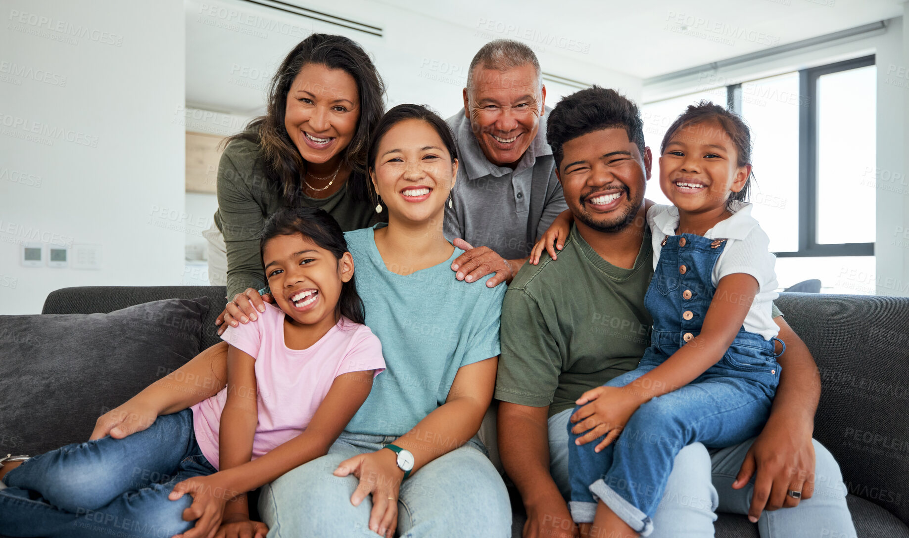 Buy stock photo Family, children and love with kids, grandparents and parents sitting on a sofa in the living room of their home during a visit. Happy, smile and together with a senior man, woman and their relatives
