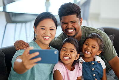 Buy stock photo Family selfie, phone smile and parents happy with children on living room sofa, love on video call and relax with technology in house. Mother and father taking photo with girl siblings on tech
