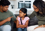 Family, discipline and fight with parents and girl in living room talking for communication, warning or problem. Frustrated, conflict and sad with dad, mom and child with behaviour stress or angry