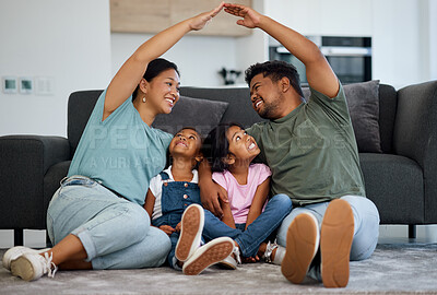 Buy stock photo Happy family, floor and hands roof for safety, support and care or affection in home. Love, protection or house insurance symbol, caring parents and kids or girls sitting bonding in security together