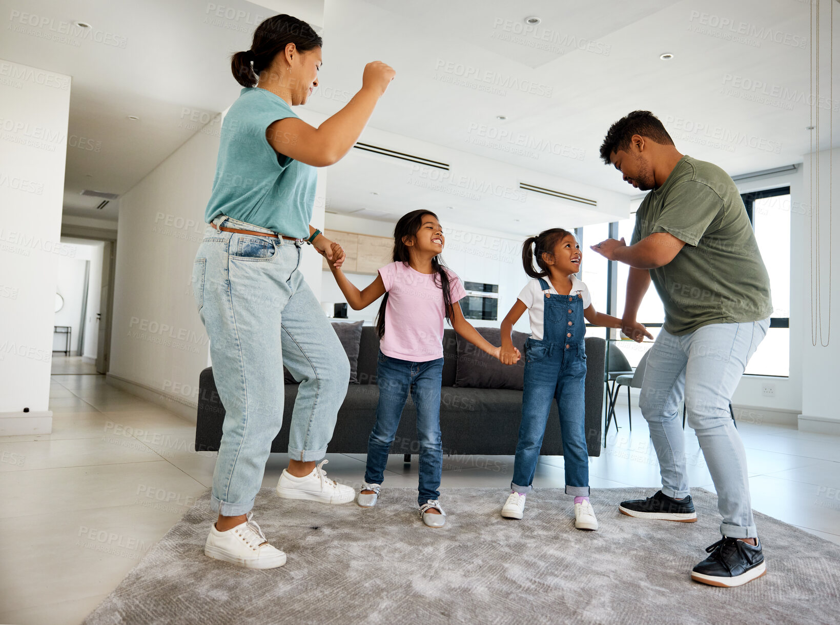 Buy stock photo Family dancing, happy house and parents teaching children to dance, moving to music together and smile for love in home living room. Silly girl kids playing with fun mother and father in lounge