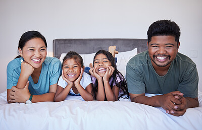 Buy stock photo Love, bed and portrait of relax happy family in hotel bedroom  bonding, smile and enjoy quality time together. Happiness, peace and Malaysia family of mom, dad and children on travel holiday vacation