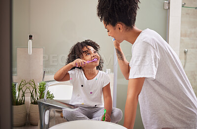 Buy stock photo Family morning, dental cleaning and mother teaching child to brush teeth in bathroom, care for mouth health and smile for healthcare with toothbrush. Girl happy learning about dentistry with mom