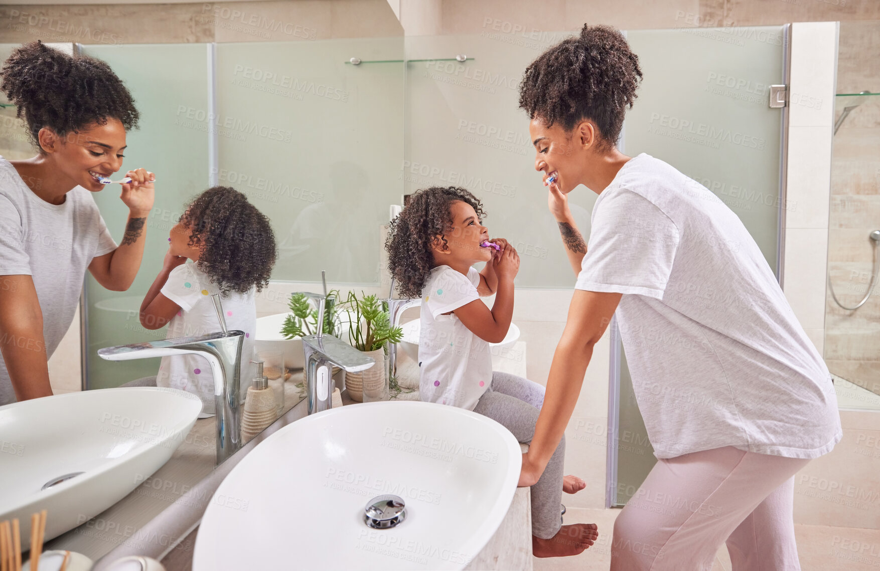 Buy stock photo Child, dental and toothbrush with a girl and her mother brushing their teeth together in the bathroom of their home. Family, hygiene and oral with a woman and daughter practicing care and hygiene