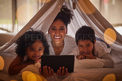 Buy stock photo Family portrait, tablet and online app for kids cartoons, streaming and digital night story in blanket fort tent at home. Happy Brazil mother, smile children and reading, playing on internet tech
