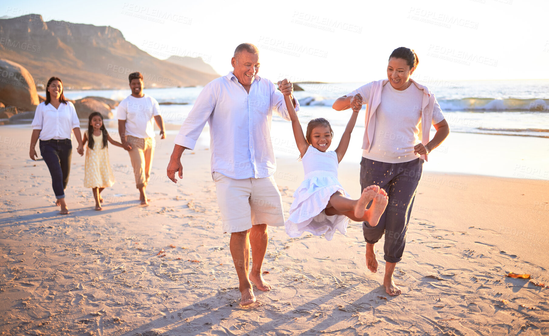 Buy stock photo Relax, travel and happy with big family at the beach on Mexico vacation with love, support and summer. Sunset, nature and trust with grandparents, children and parents holding hands on holiday